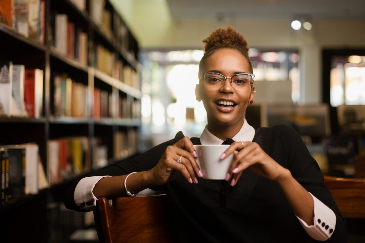 Black african american young yoman drinking coffee